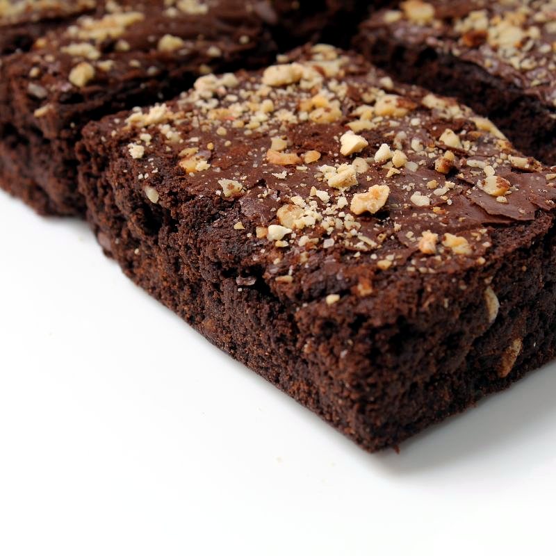 Dark fudgy brownie squares topped with roasted nut crumble